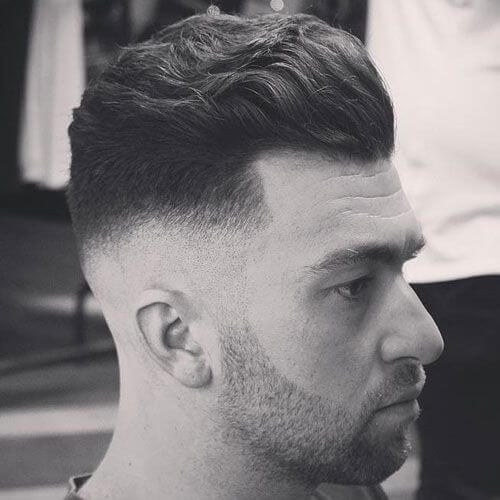 Mid Zero Fade with Wavy Brushed Back Hair