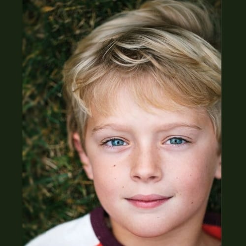 boy with retro blonde wave haircut