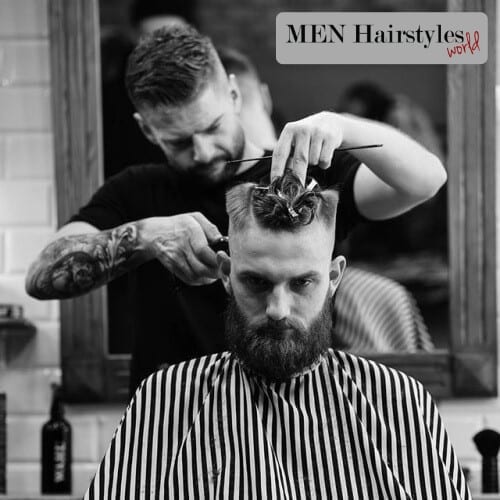 hairstylist giving a man a haircut