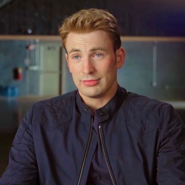 Messy Quiff Captain America Hairstyle - Chris Evans in all all dark blue jacket with under shirt.