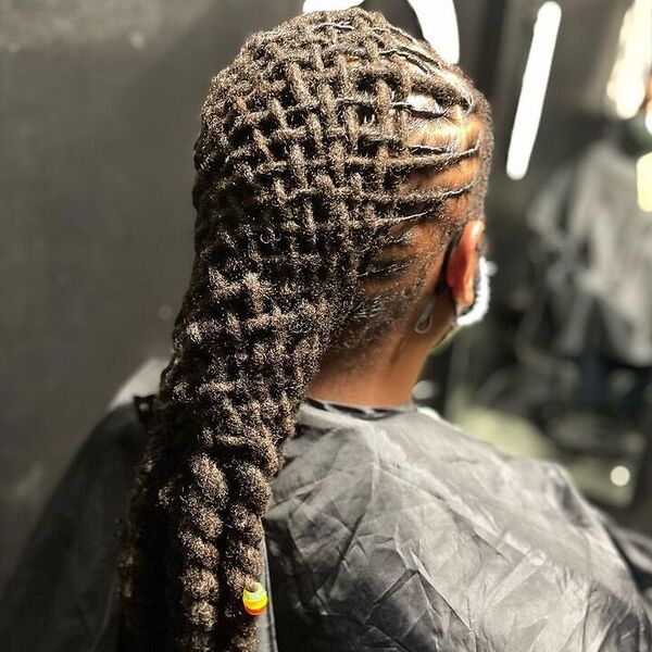 Box Locs Basket style with Jumbo Rope twist - a man wearing barber cape.