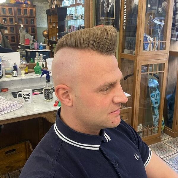 Brushed Up Sharky Ducktail Haircut - a man wearing a dark blue polo.