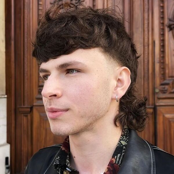 Cut Mullet Curl - a man wearing leather jacket.