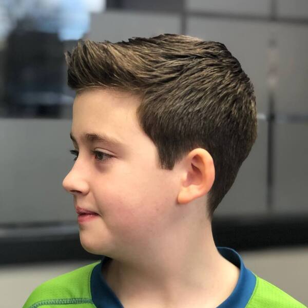Hard Side Part with Tapered Sides - a kid wearing a neon green shirt.