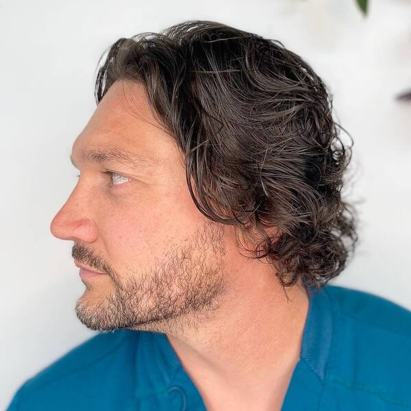 Middle Part with Curl ends - a man wearing a blue shirt.