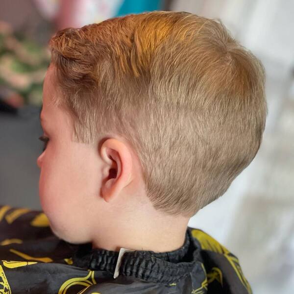 Natural Blond in Curtain Bangs - a little boy in barber cape.