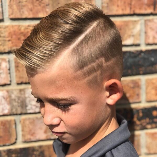 Pompadour Fade with Lightning Bolt - a boy wearing gray polo shirt.