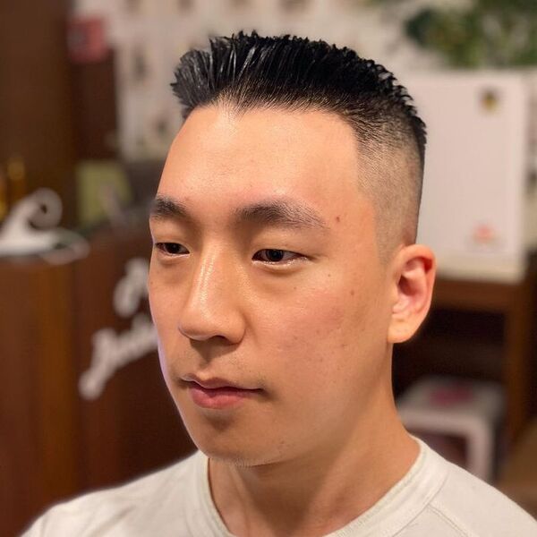 Spiky Side Part Haircut - a man wearing a plain white shirt.