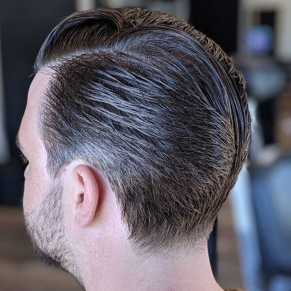 Thick Hair Ducktail Haircut - a man wearing a brown shirt.