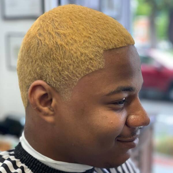 Yellow Tinted Taperedwaves Balding Crown Haircut - a man wearing stripe barber cape.