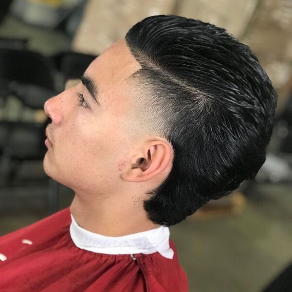 Combed Over Fade Mullet - a man wearing red barber cape.