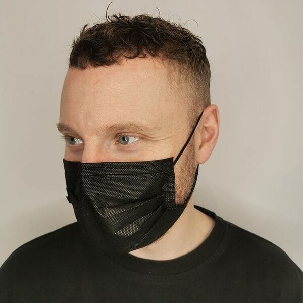 Curly Crew Cut Fade - a man wearing plain black shirt and mask.