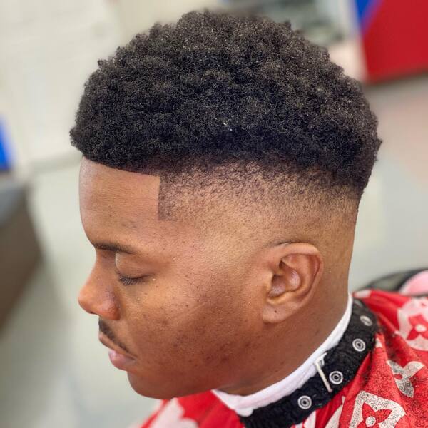 Fro Ball Fade Fuckboy Haircut - a man wearing a red barber cape