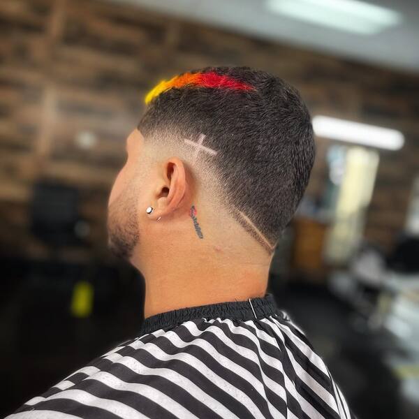 V-Cut Style Hair - a man wearing a striped barber cape