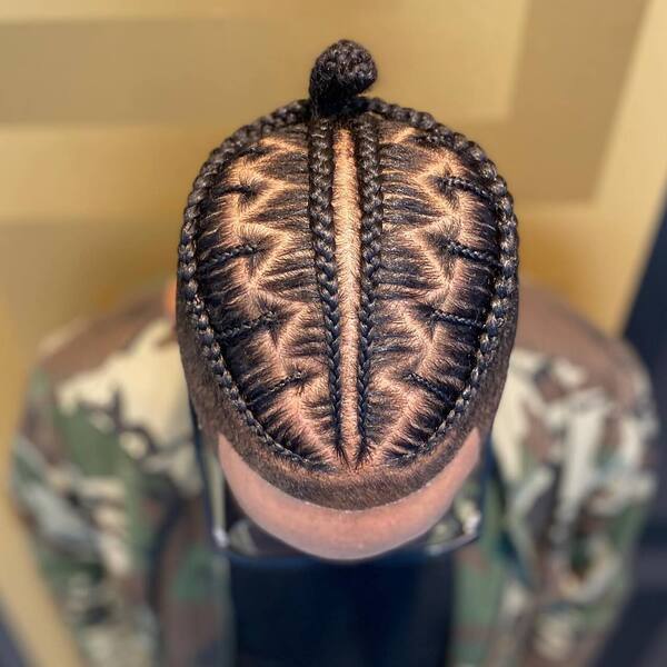 Artsy Man Bun Braids Hairstyle with Faded Cut - wearing an eyeglasses