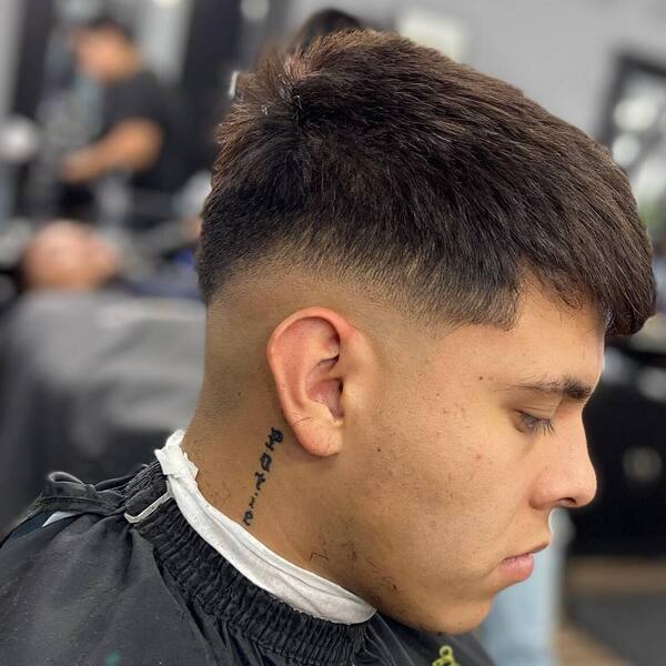 Natural Taper Haircut with Low Skin Burst Fade - has a tattoo on his neck