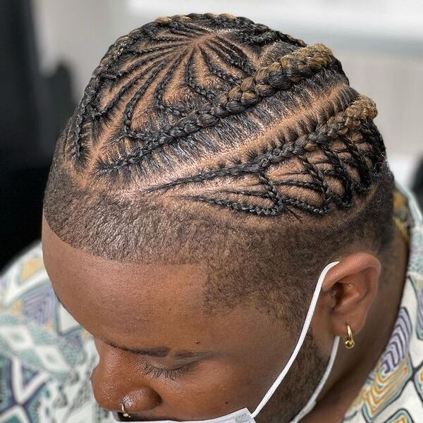 Tight Braids with Light Blonde Shade Fade Cut - has a piercing on his nose