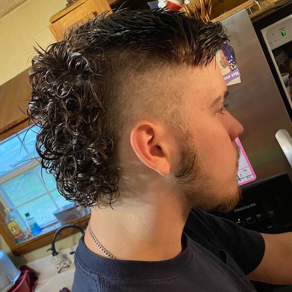 Back Full Perm Curls with Side Swept Mullet Men Hair - wearing a black shirt