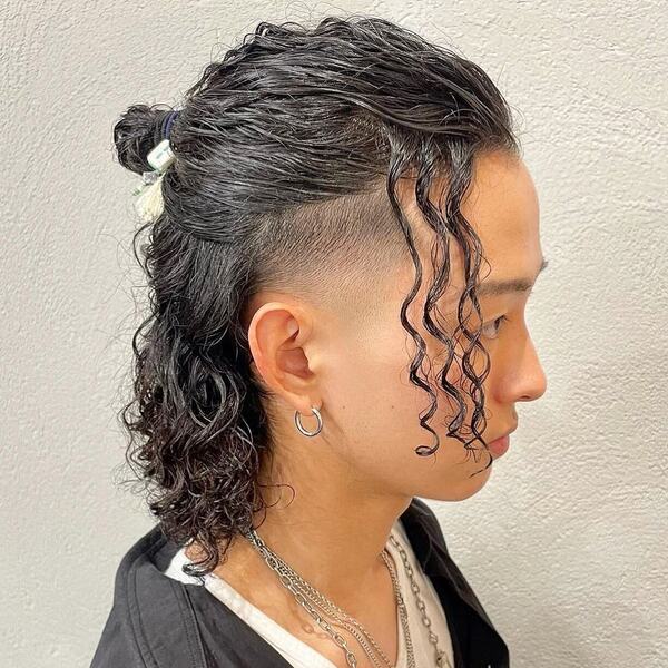 Long Bob Curly Man Bun Hairstyle with Fade - wearing a couple of silver necklace chain