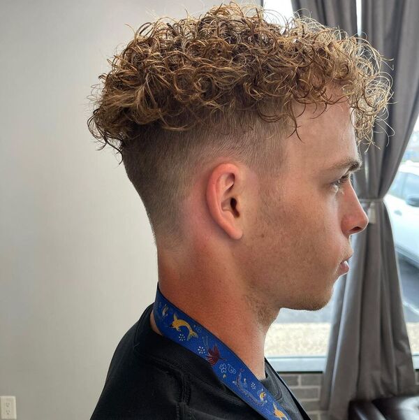 Natural Perm Brown Curls with Fade Cut - wearing a black shirt