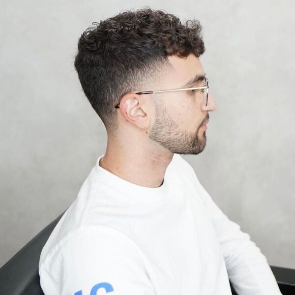 Short Taper Perm Curls with Fade - wearing a white long sleeve