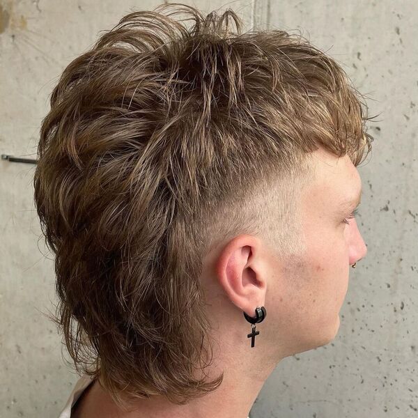 Baseball Haircut - wearing black cross sign earring