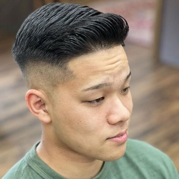 Comb Over Hairstyle with Wet Look Taper Hair - wearing green color shirt