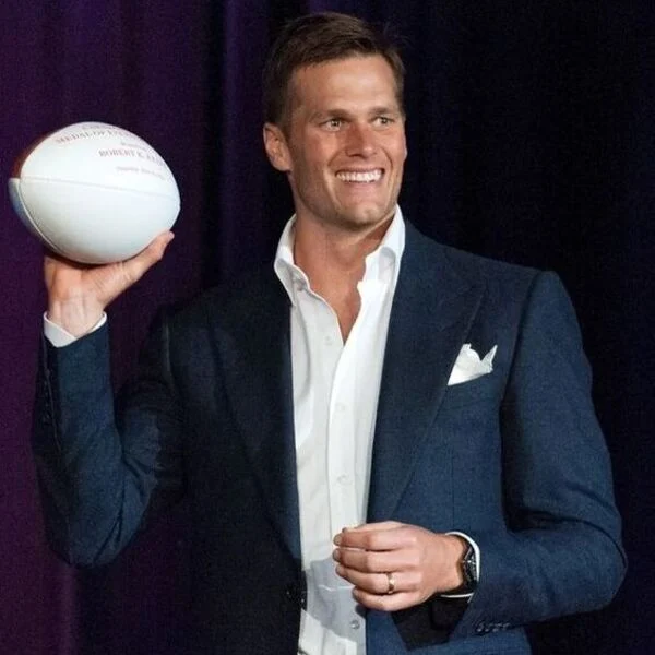Tom Brady Haircut Curtain Hair with Thick Side Parted Style - wearing a ball