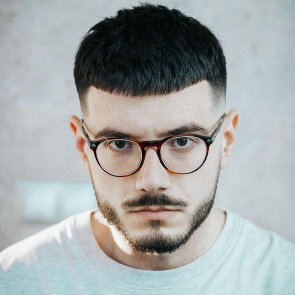 wearing light green fade shirt and eyeglass