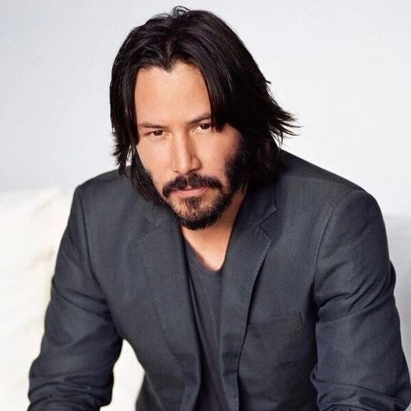 Keanu Reeves Hairstyle  - wearing formal tuxedo with inner gray shirt
