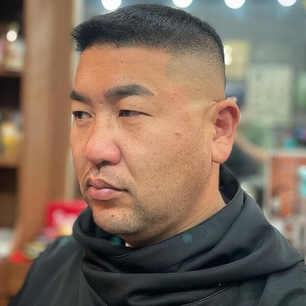 Pomp Front Hairstyle with Skin Fade Box Hair - wearing black haircut cover plain