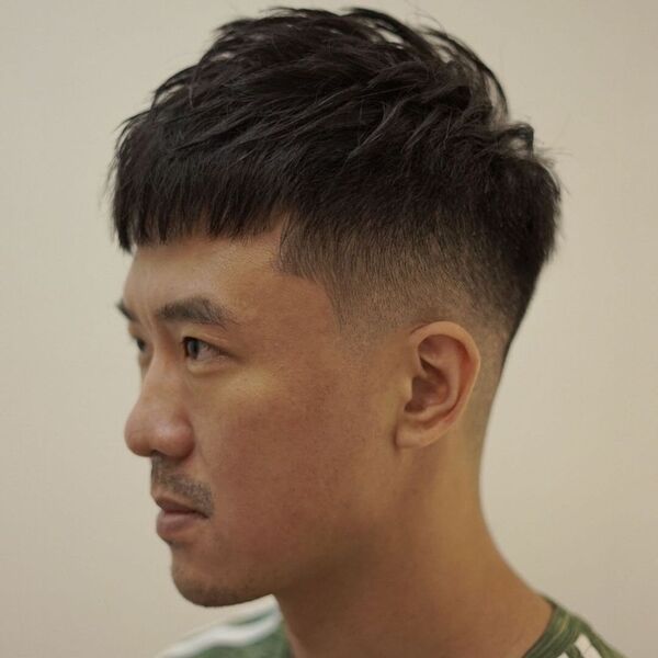 Textured Haircut with Layered Fringe Style - wearing green shirt with stripped