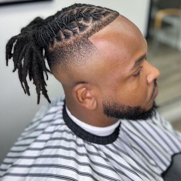 Twisted Man Bun Hairstyle with Undercut Fade Hair - wearing stripped haircut cover