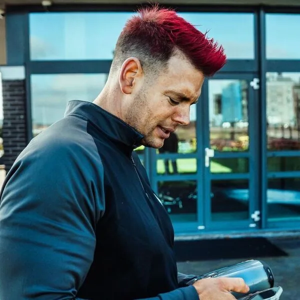 a man wearing fitted top attire with his one of the famous red hair men ideas