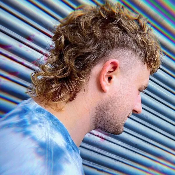 Wavy Mullet Hairstyle with Brown Blonde Hair - wearing blue dye shirt