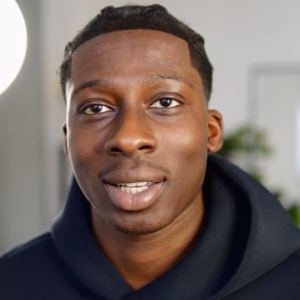 Box haircut with tight braids and trimmed taper fade